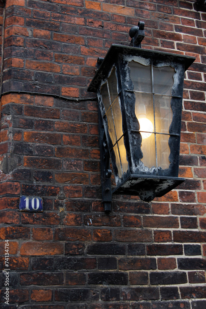 Charming street lantern on an old brick wall, Hamburg, Germany