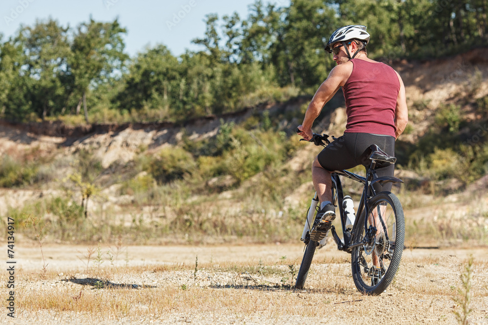 Fototapeta premium athlete man cycling on a bicycle