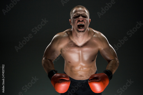 Muscular man screaming and roar