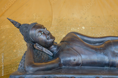 Reclining Buddha at  Wat Ratchprakongtham  Nonthaburi Thailand. photo