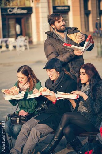 Friends Eating Pizza Outdoors