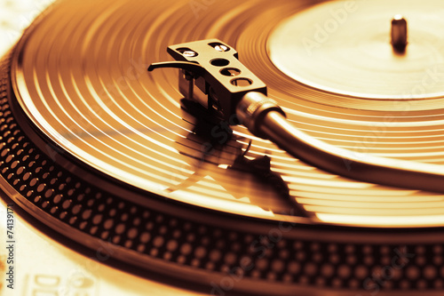 Old fashioned turntable playing a track
