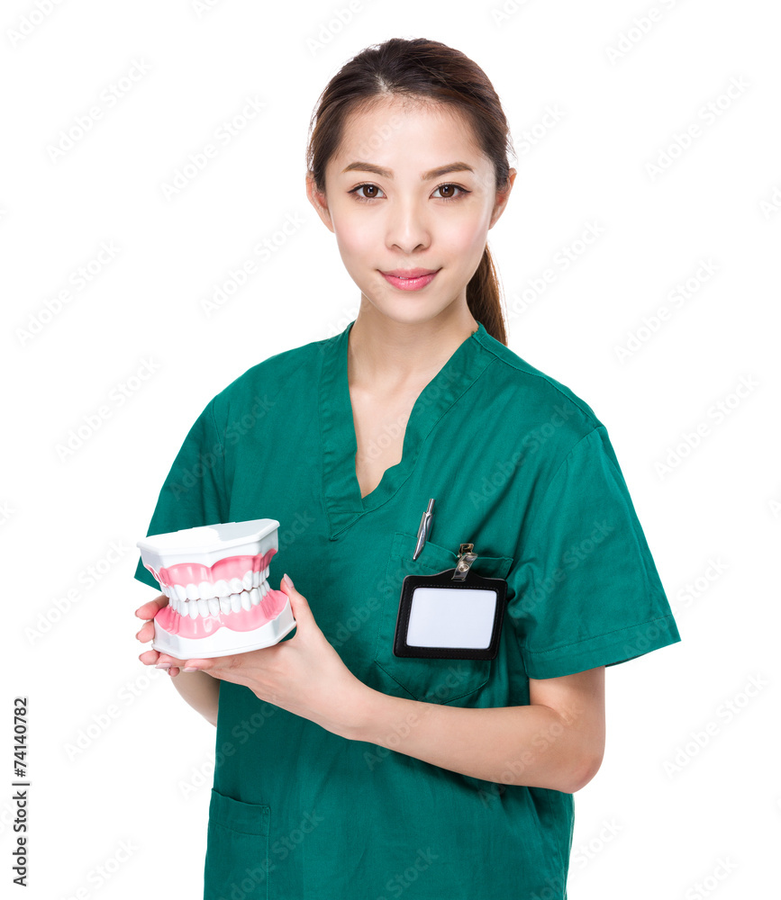 Dentist hold up with denture