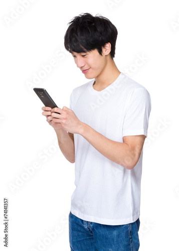 Asian Man look at cellphone
