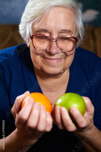 Senior woman with fruits