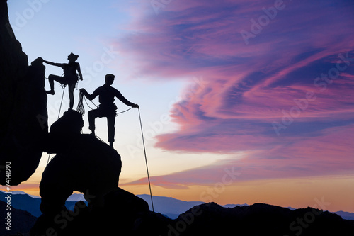 Climbing team on the edge.