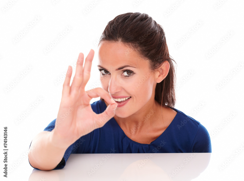 Cheerful woman making a great job sign front view Cheerful woman making a great job sign front view
