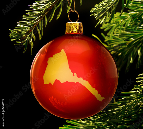 Red bauble with the golden shape of Eritrea