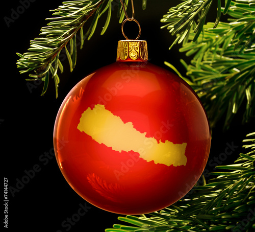 Red bauble with the golden shape of Nepal
