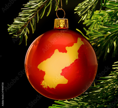 Red bauble with the golden shape of North Korea