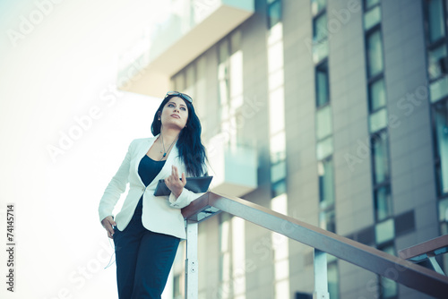 beautiful long black hair elegant business woman with tablet