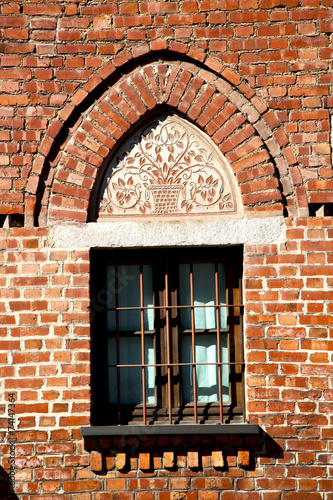 rose window   in  the castellanza  old   church   closed brick photo