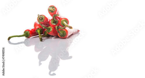 Red chili peppers over white background