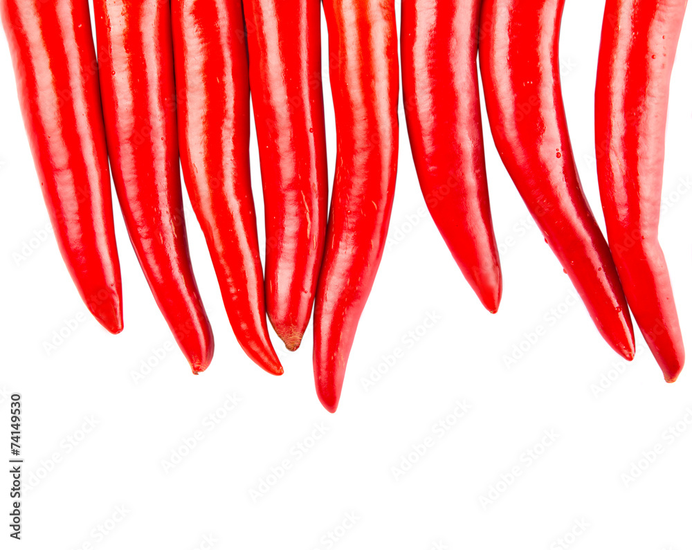 Red chili peppers over white background Red chili peppers over white background