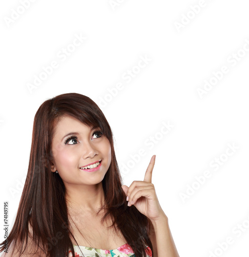 attractive young woman pointing up