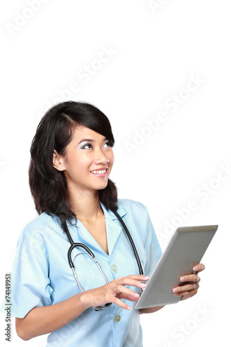 Beautiful doctor using tablet computer