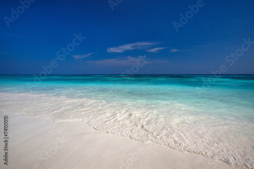 beach with clear waters and white fine sand