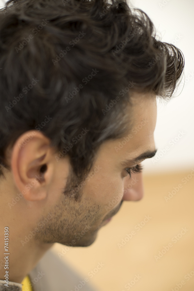 Fototapeta premium Young man at hairdresser salon