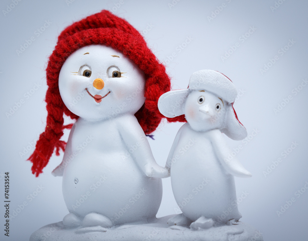 Cheerful snowman and penguin Cheerful snowman and penguin
