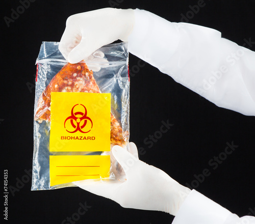 Pizza in biohazard plastic bag. photo