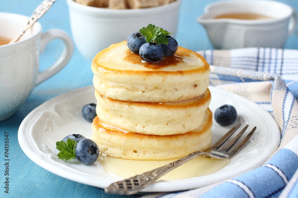 A stack of scotch pancakes with blueberries A stack of scotch pancakes with blueberries