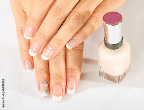 Beautiful woman s nails with beautiful french manicure.