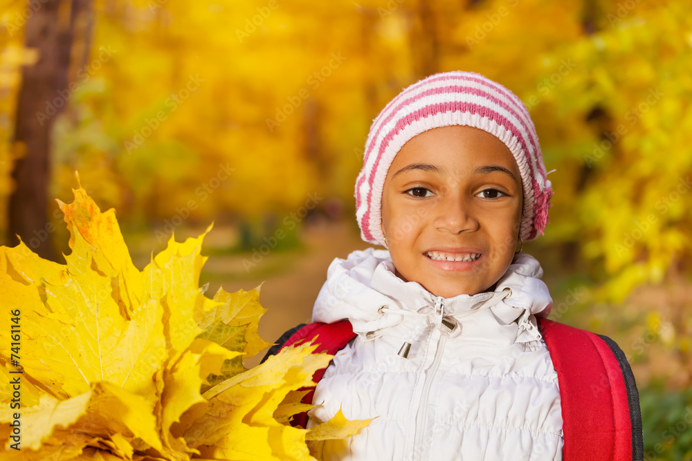 Portrait of happy African girl with leaves bunch Portrait of happy African girl with leaves bunch