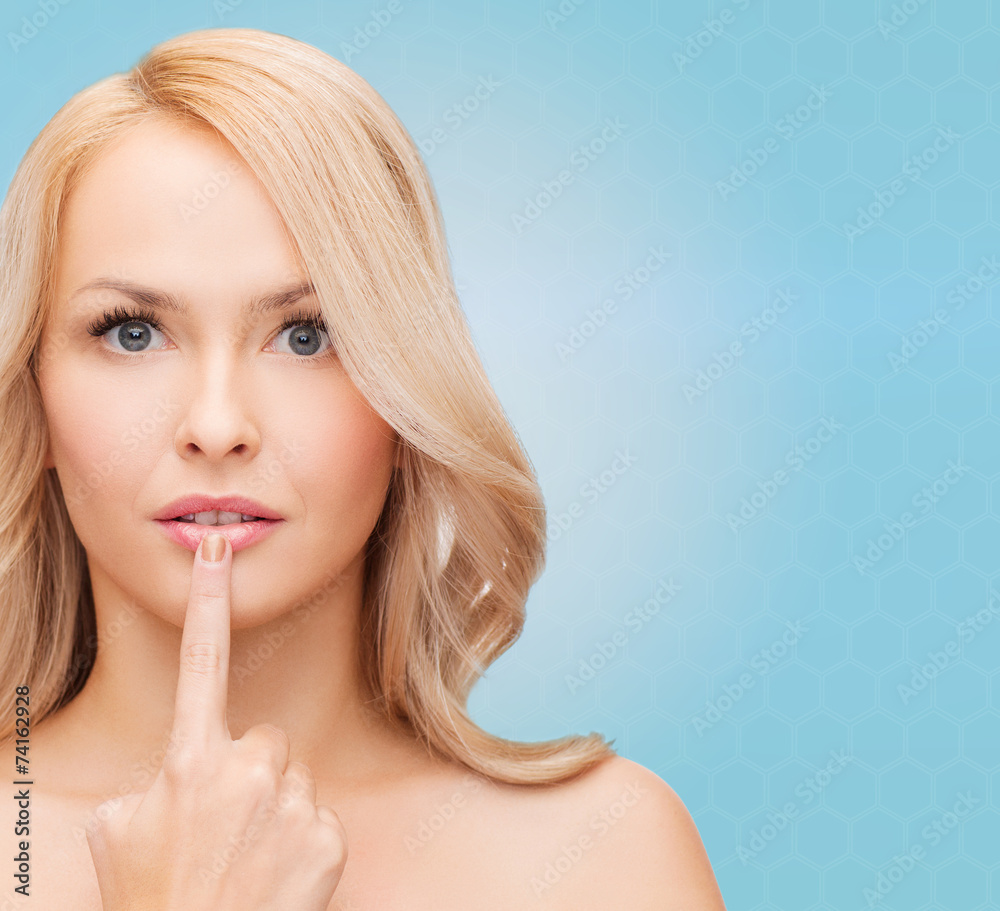 beautiful young woman touching her lips beautiful young woman touching her lips