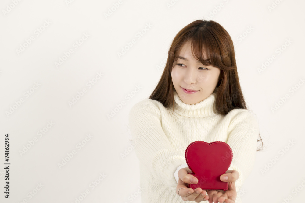 Smiling young asian woman with red heart shape Smiling young asian woman with red heart shape