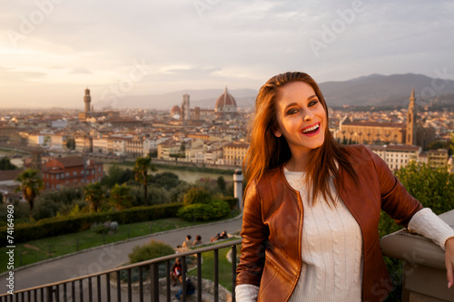 Beautiful smiling woman with background of Florence, Tuscany.