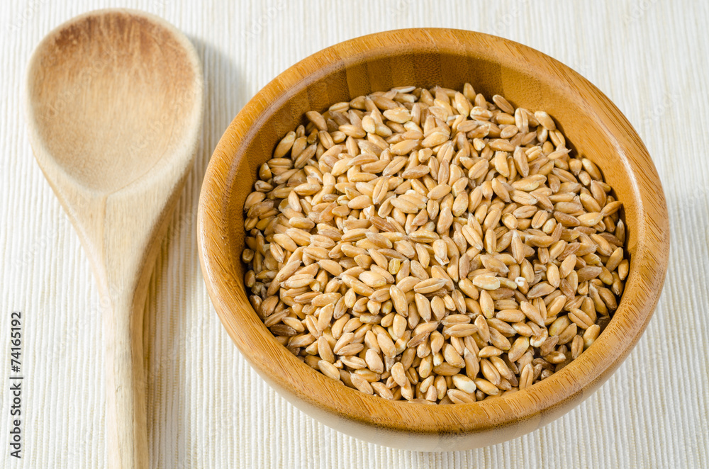 spelt with spoon, close up spelt with spoon, close up