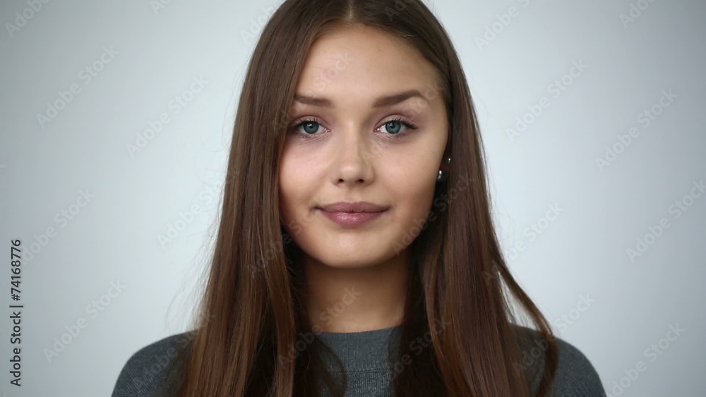 Young girl with braces on teeth looking at camera and smiling. Young girl with braces on teeth looking at camera and smiling.