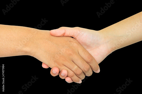 two persons shaking hands on black background