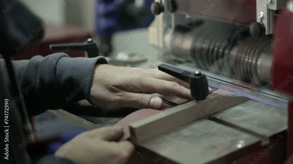 Man cuts the skin for the production of women's handbags Man cuts the skin for the production of women's handbags