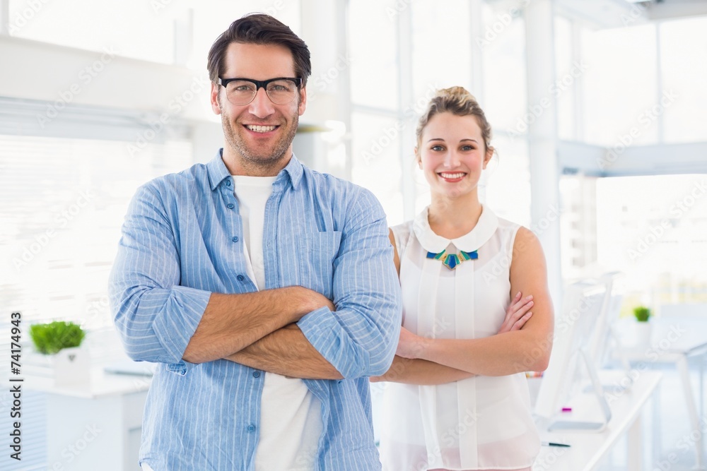 Fototapeta premium Smilling photo editor posing with arms crossed