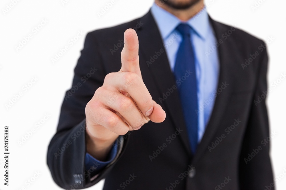 Businessman pointing his finger at camera Businessman pointing his finger at camera