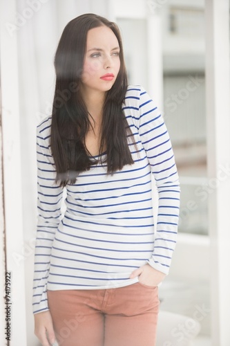 Free Download Pretty brunette looking out window - GFXLoad