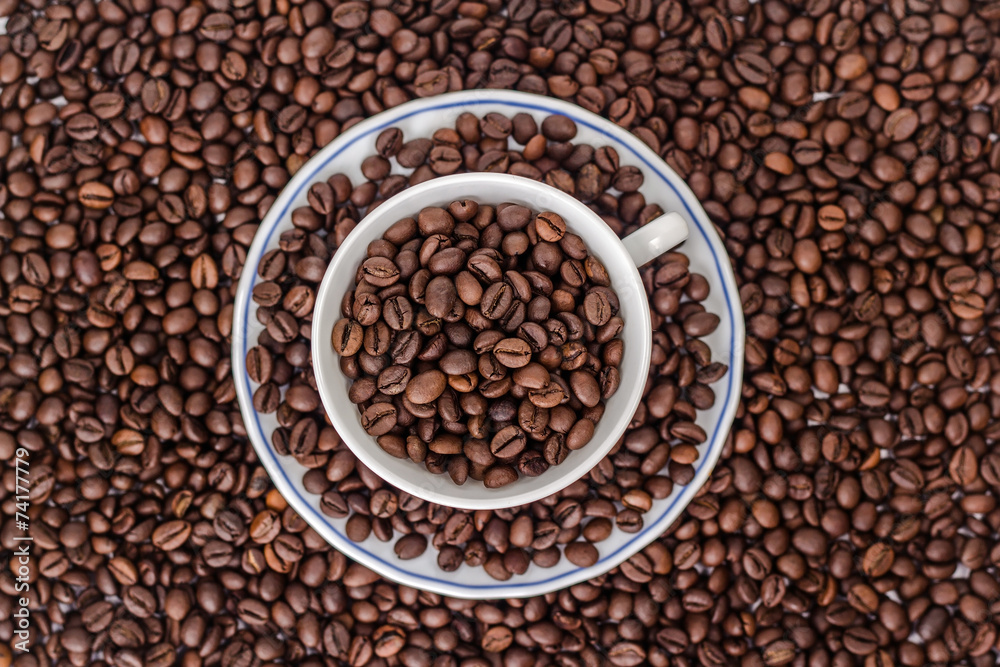Cup and saucer with coffee beans Cup and saucer with coffee beans