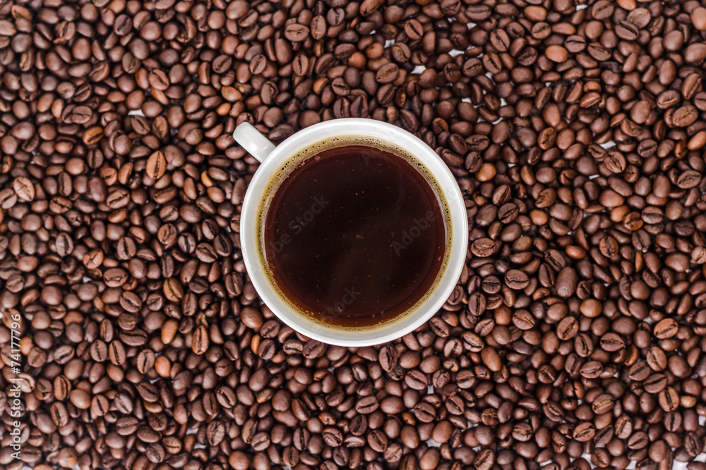 cup of coffee on the background of bean cup of coffee on the background of bean
