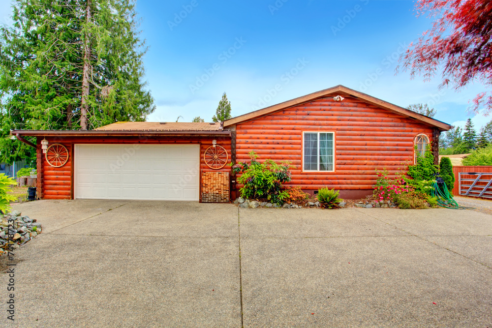 Log cabin style house exterior with garage. Log cabin style house exterior with garage.