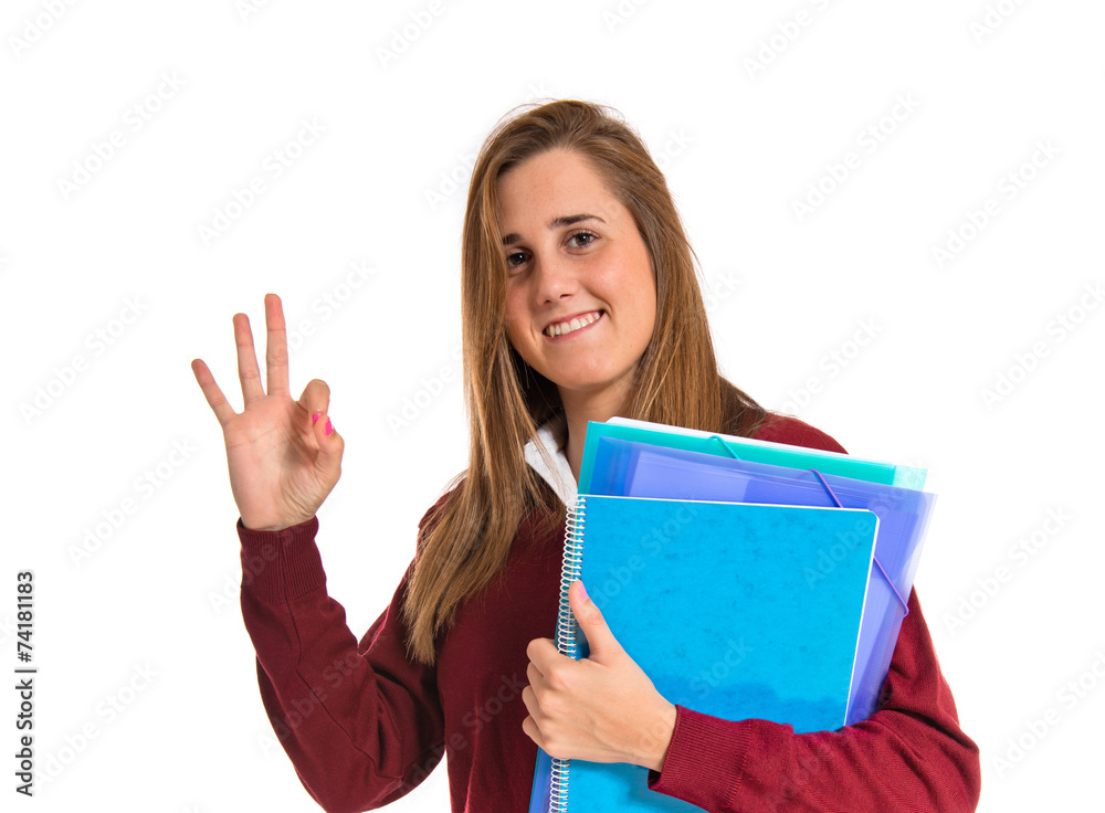 Student making Ok sign over white background Student making Ok sign over white background