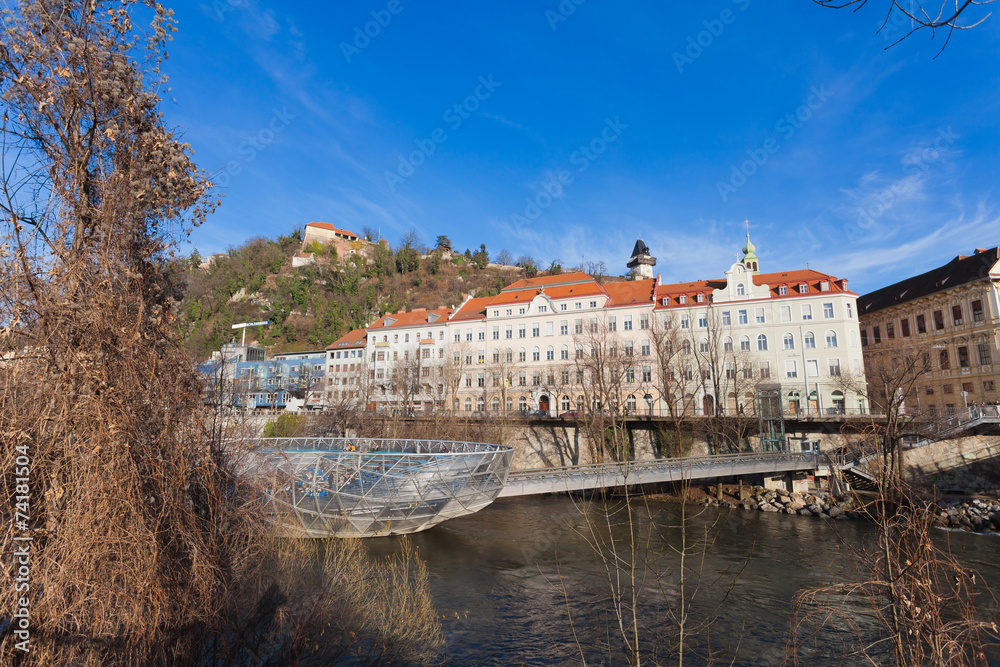 Fototapeta premium Island on Mur river connected by a modern steel and glass bridge