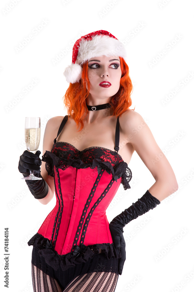 Beautiful cabaret girl in Santa Claus hat holding glass of champ Beautiful cabaret girl in Santa Claus hat holding glass of champ