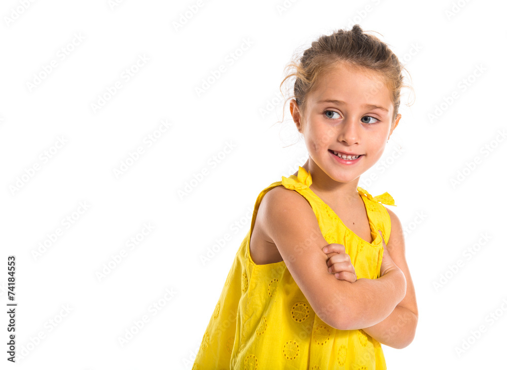 Blonde little girl walking with her arms crossed Blonde little girl walking with her arms crossed