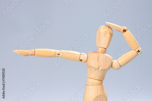 Wooden mannequin posing