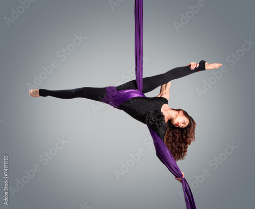Beautiful dancer on aerial silk, aerial contortion, aerial ribbo