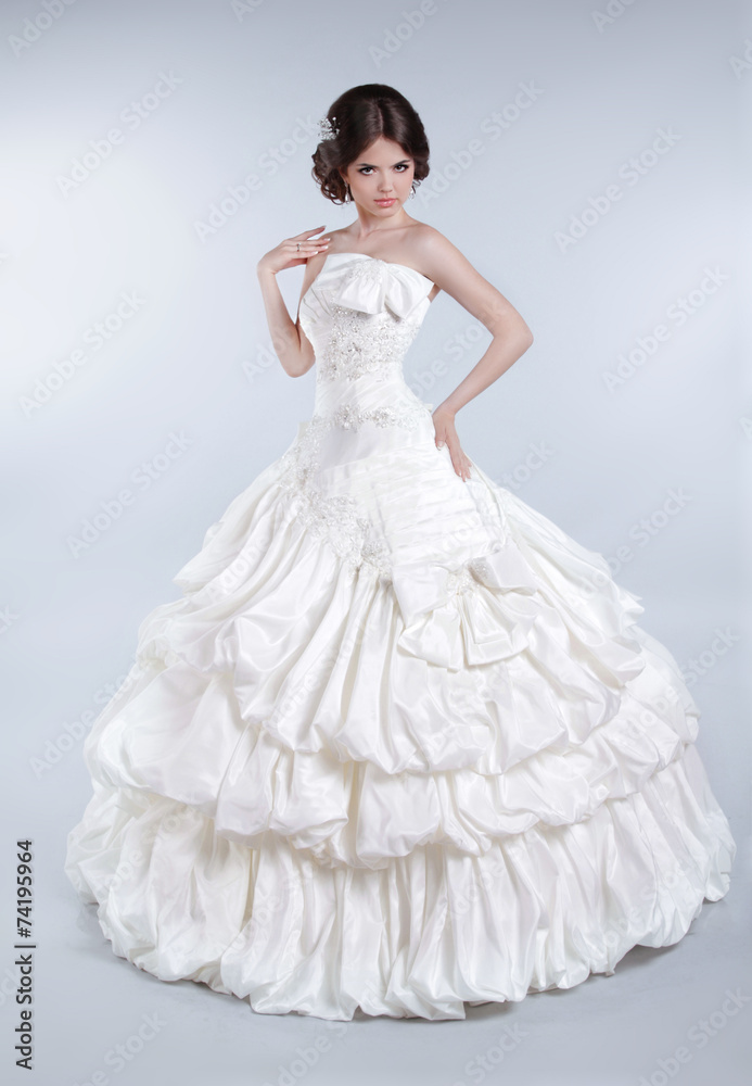 Attractive bride model girl wearing in wedding dress with volumi Attractive bride model girl wearing in wedding dress with volumi