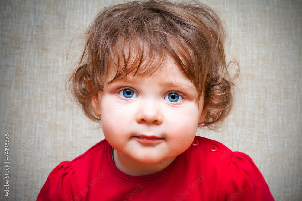 Fototapeta premium Adorable little girl with big blue eyes