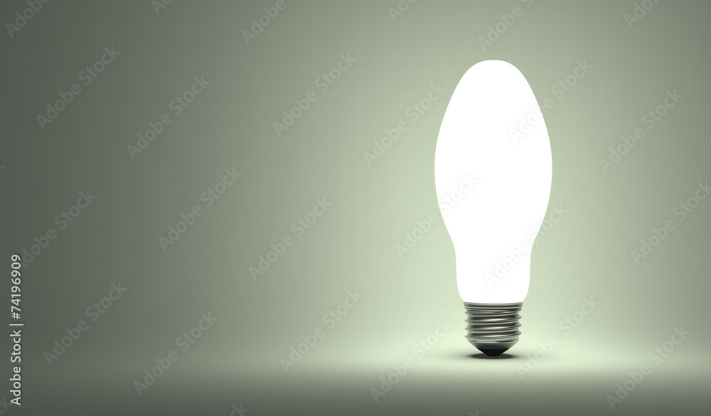 Shining ellipsoidal light bulb on gray Shining ellipsoidal light bulb on gray