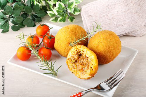 Arancini, rice balls with meat and sauce